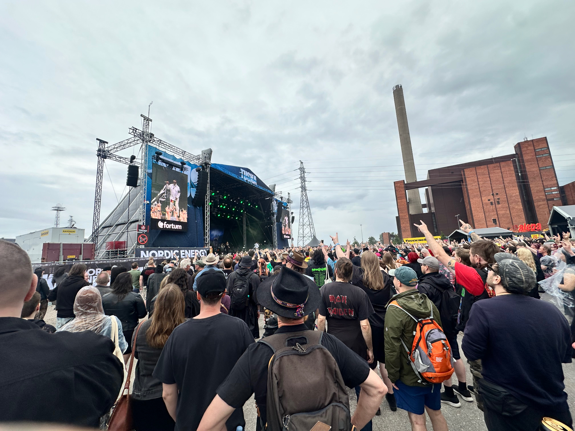 Skindred turning Suvilahti into one massive ragga-metal party. Skindred performing at Tuska Festival 2026 with the crowd throwing horns under cloudy Helsinki skies