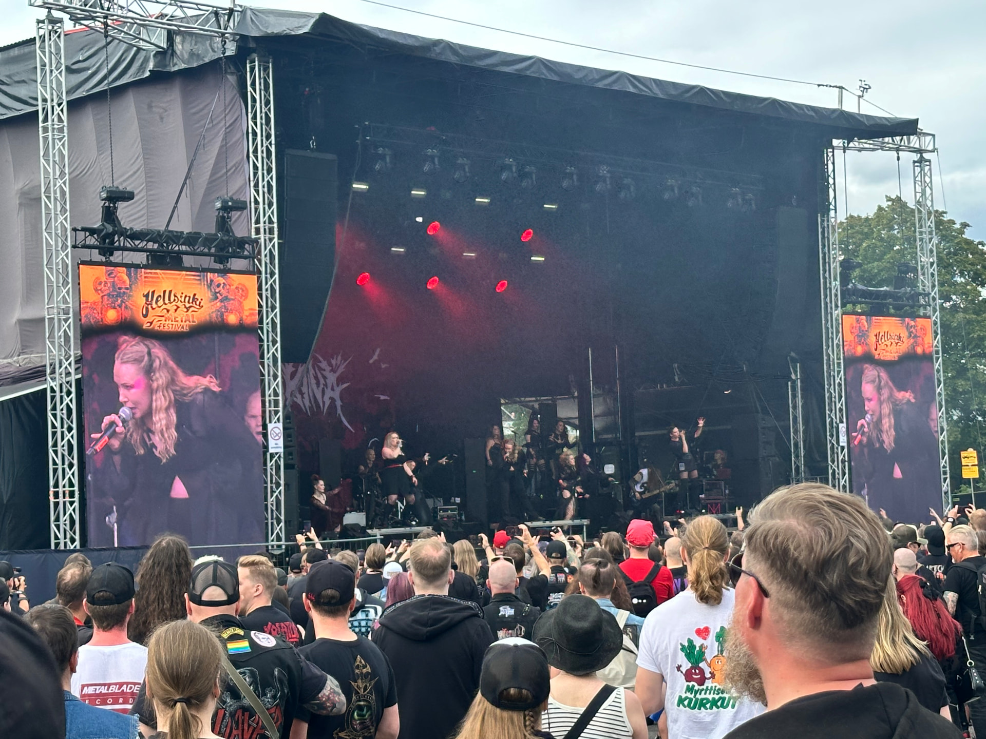 Ikinä — a full-production set for the home crowd. Ikinä performing on the Hellsinki Metal Festival 2026 stage with red lighting and a full stage production