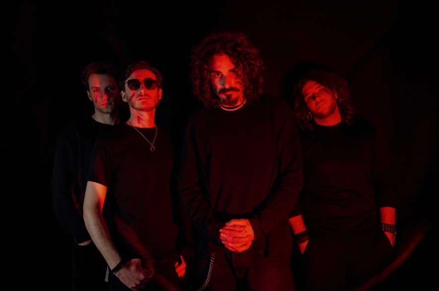 Wave Z band promo photo — Marco, Antonio, Bart and Alfonso lit in red light