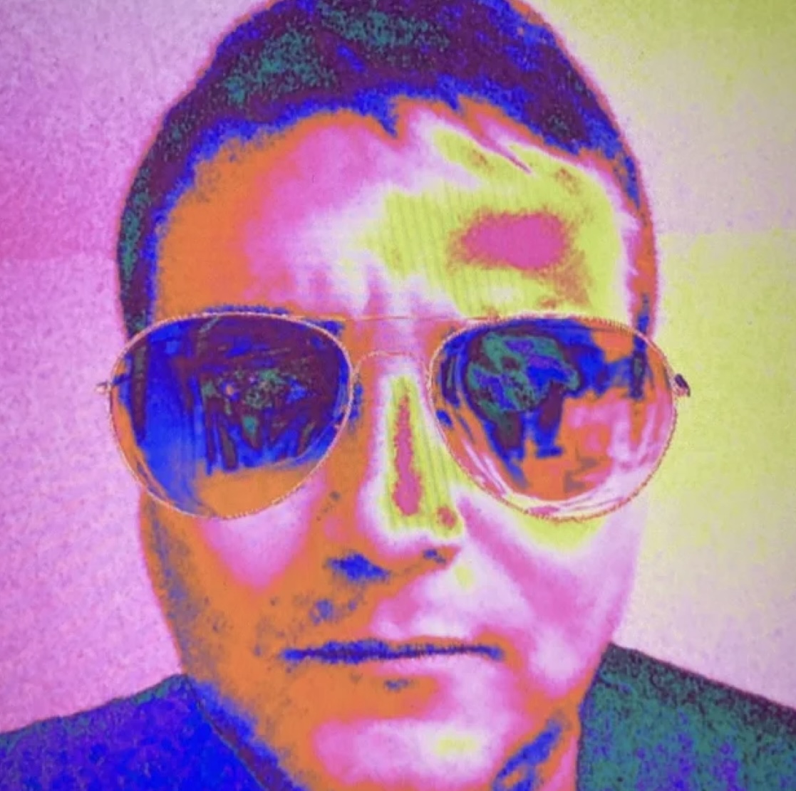 Edik San — pop-art style portrait of the Belgian composer in aviator sunglasses on a pink and yellow background