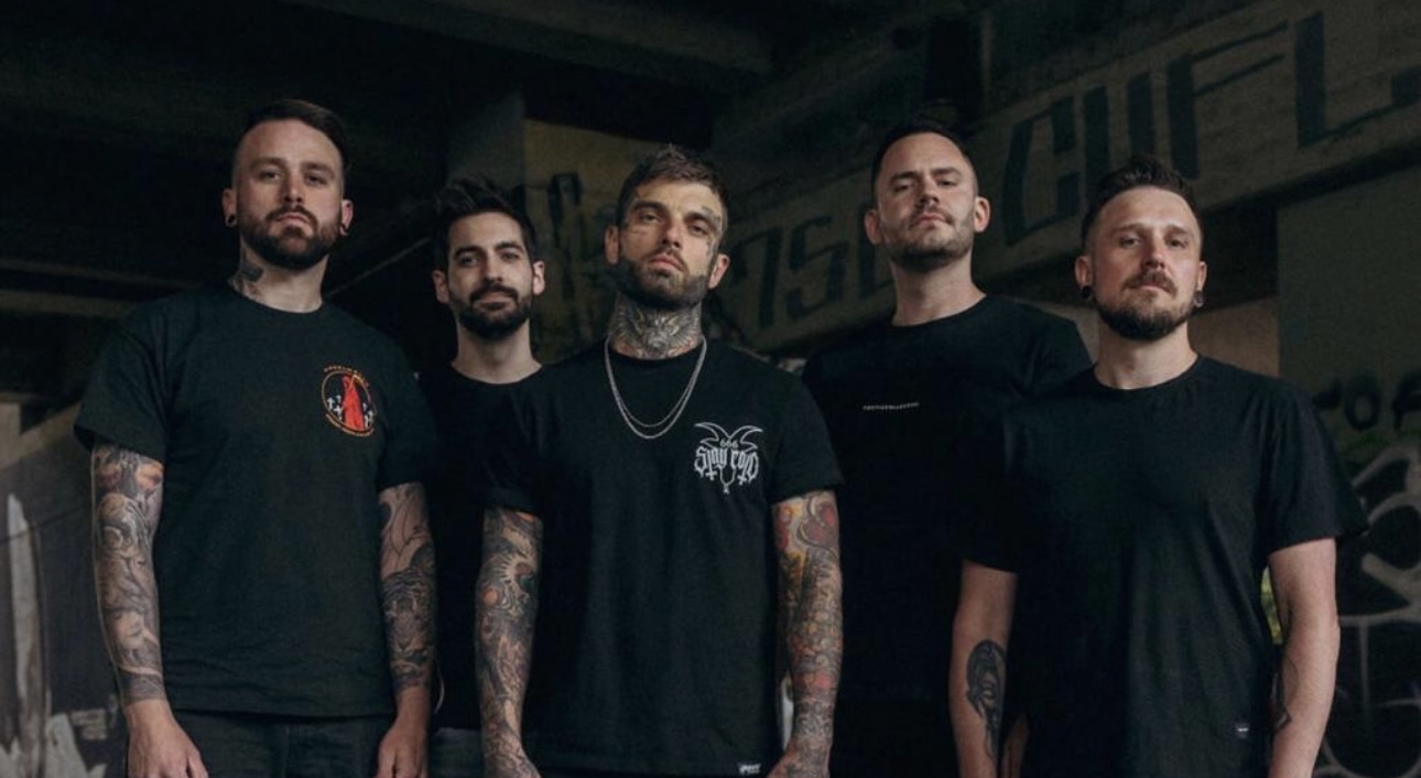 Bury The Liar band photo: five members in black shirts standing under a concrete underpass