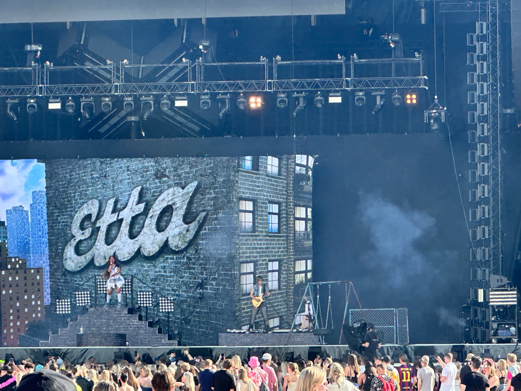Etta — full pop production on the main stage. Etta performing on Ruisrock 2026 main stage with NYC brick-wall backdrop